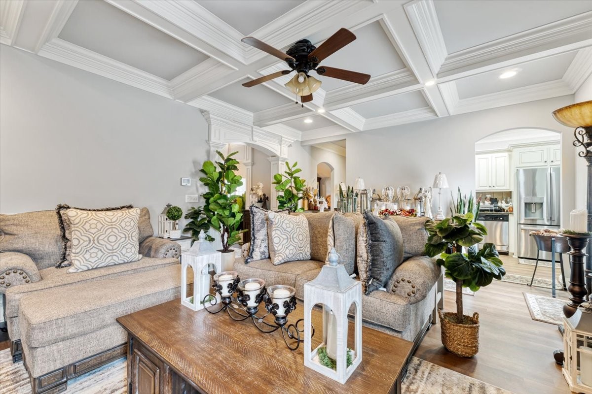 106 Riley Creek Road Tullahoma, TN 37388 - Photo 5 of 25 a living room with furniture and a chandelier