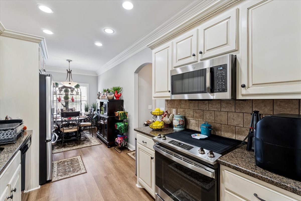 106 Riley Creek Road Tullahoma, TN 37388 - Photo 7 of 25 a kitchen with a stove and a microwave