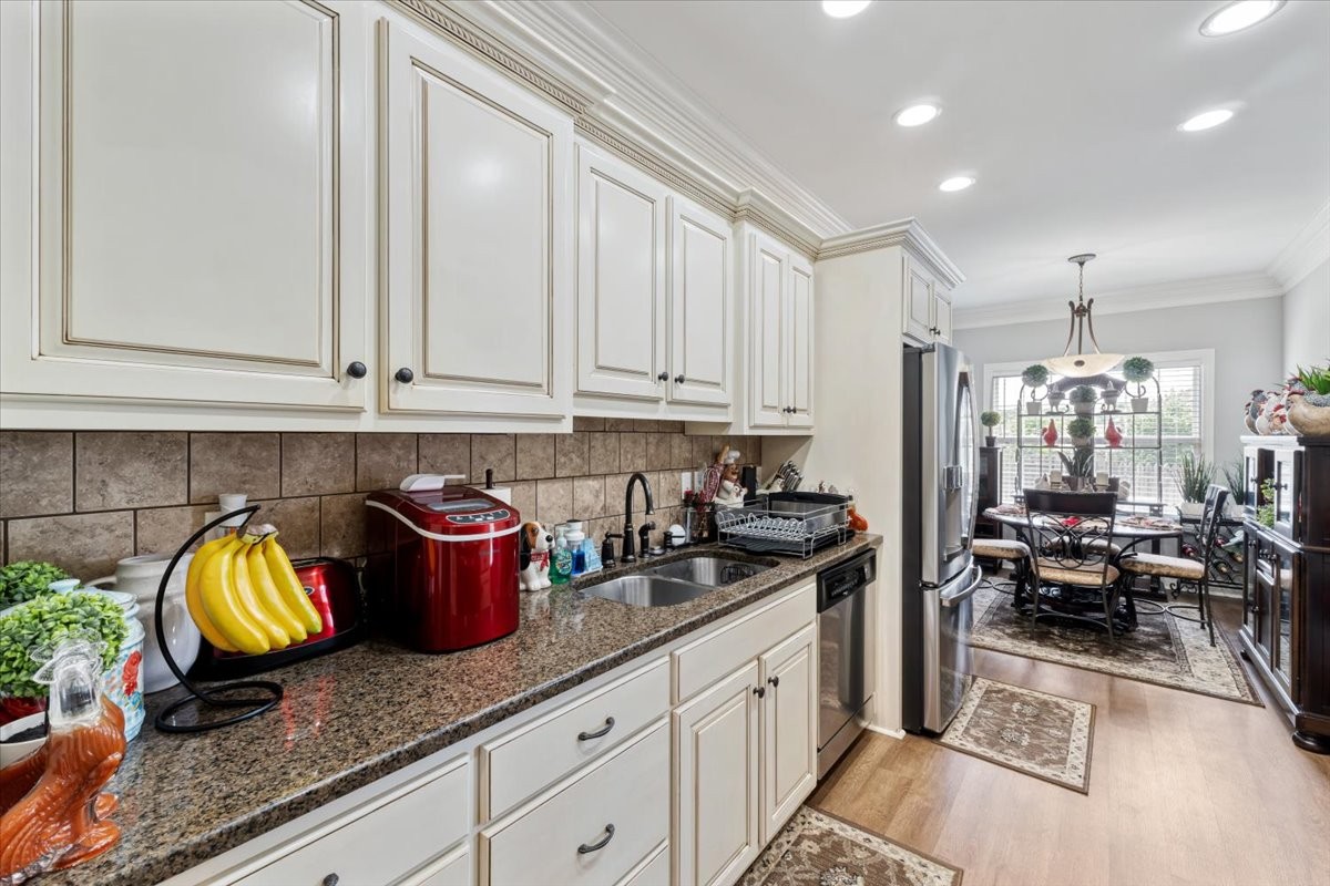 106 Riley Creek Road Tullahoma, TN 37388 - Photo 8 of 25 a kitchen with stainless steel appliances granite countertop a sink stove and cabinets