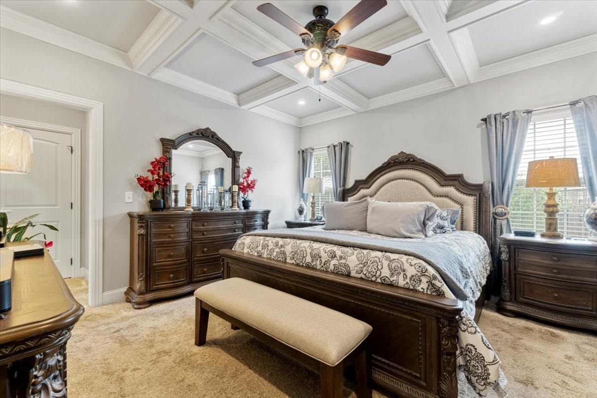 106 Riley Creek Road Tullahoma, TN 37388 - Photo 10 of 25 a bedroom with a bed a chandelier and dresser