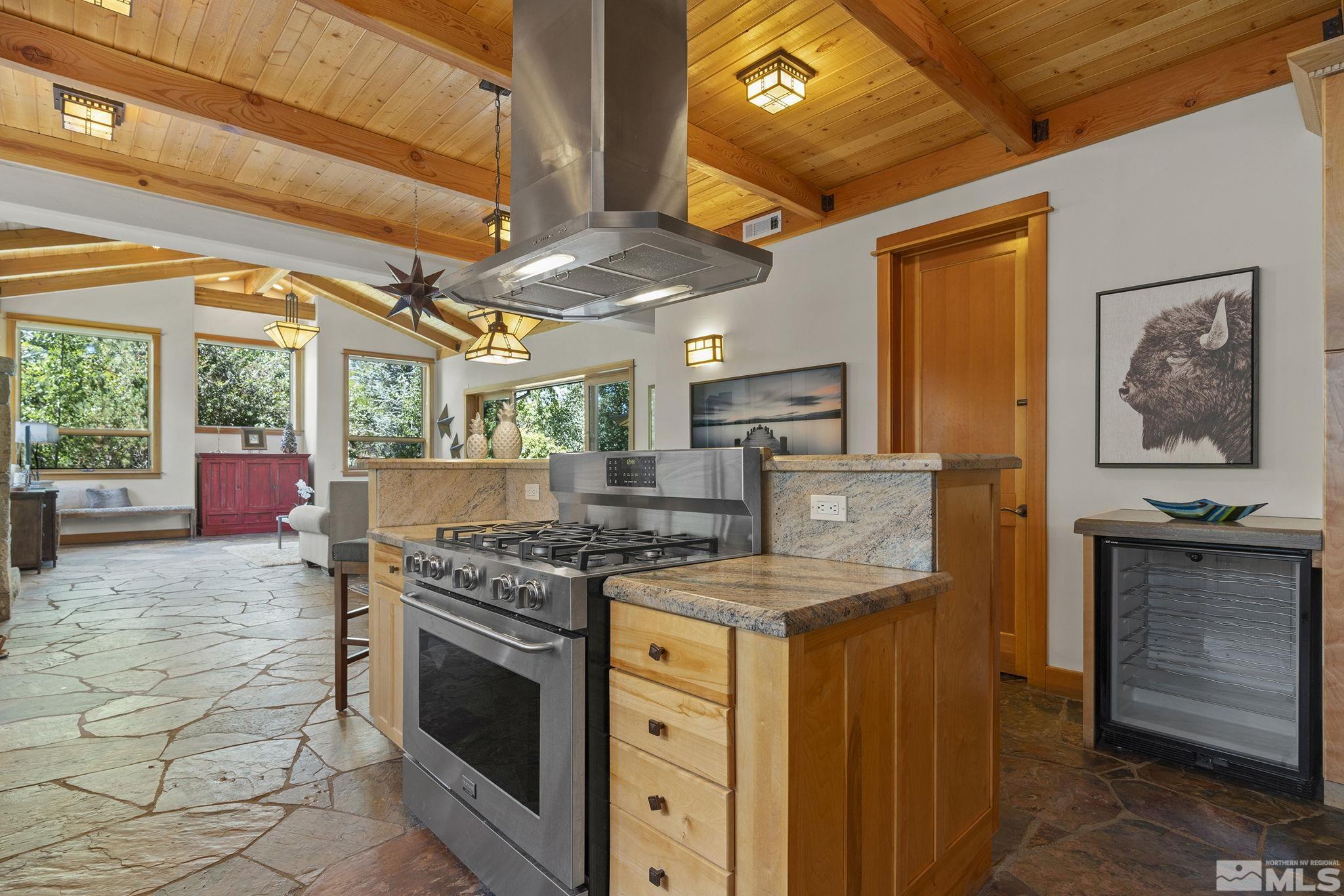 7035 Quail Rock Lane Reno, NV 89511 - Photo 15 of 37 a kitchen with a stove and a refrigerator