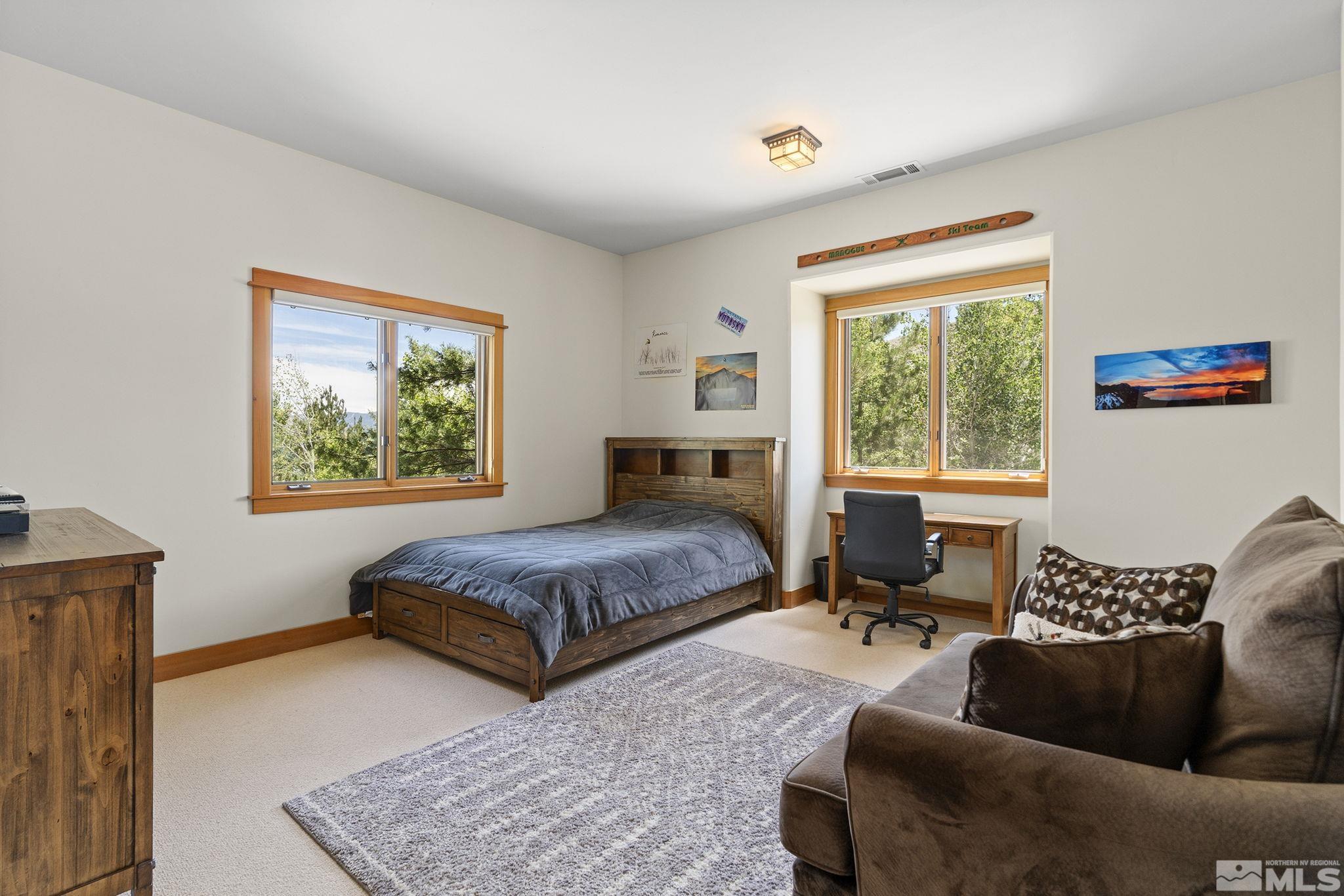 7035 Quail Rock Lane Reno, NV 89511 - Photo 20 of 37 a living room with furniture and a window
