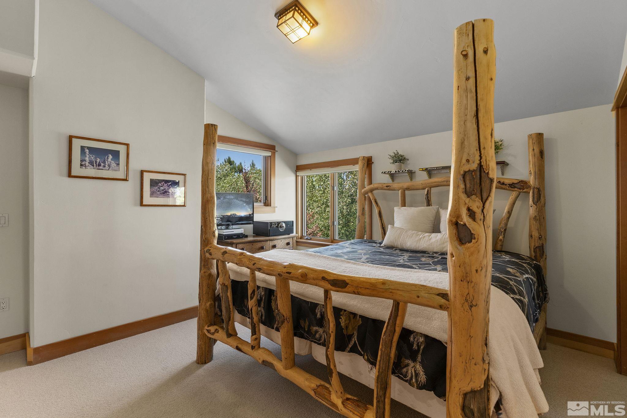 7035 Quail Rock Lane Reno, NV 89511 - Photo 24 of 37 a bedroom with a bed and a table