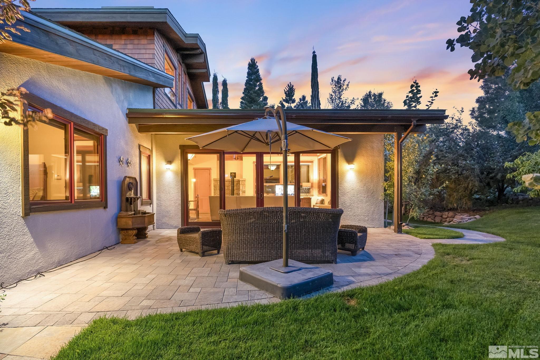 7035 Quail Rock Lane Reno, NV 89511 - Photo 28 of 37 a view of a porch with furniture and yard
