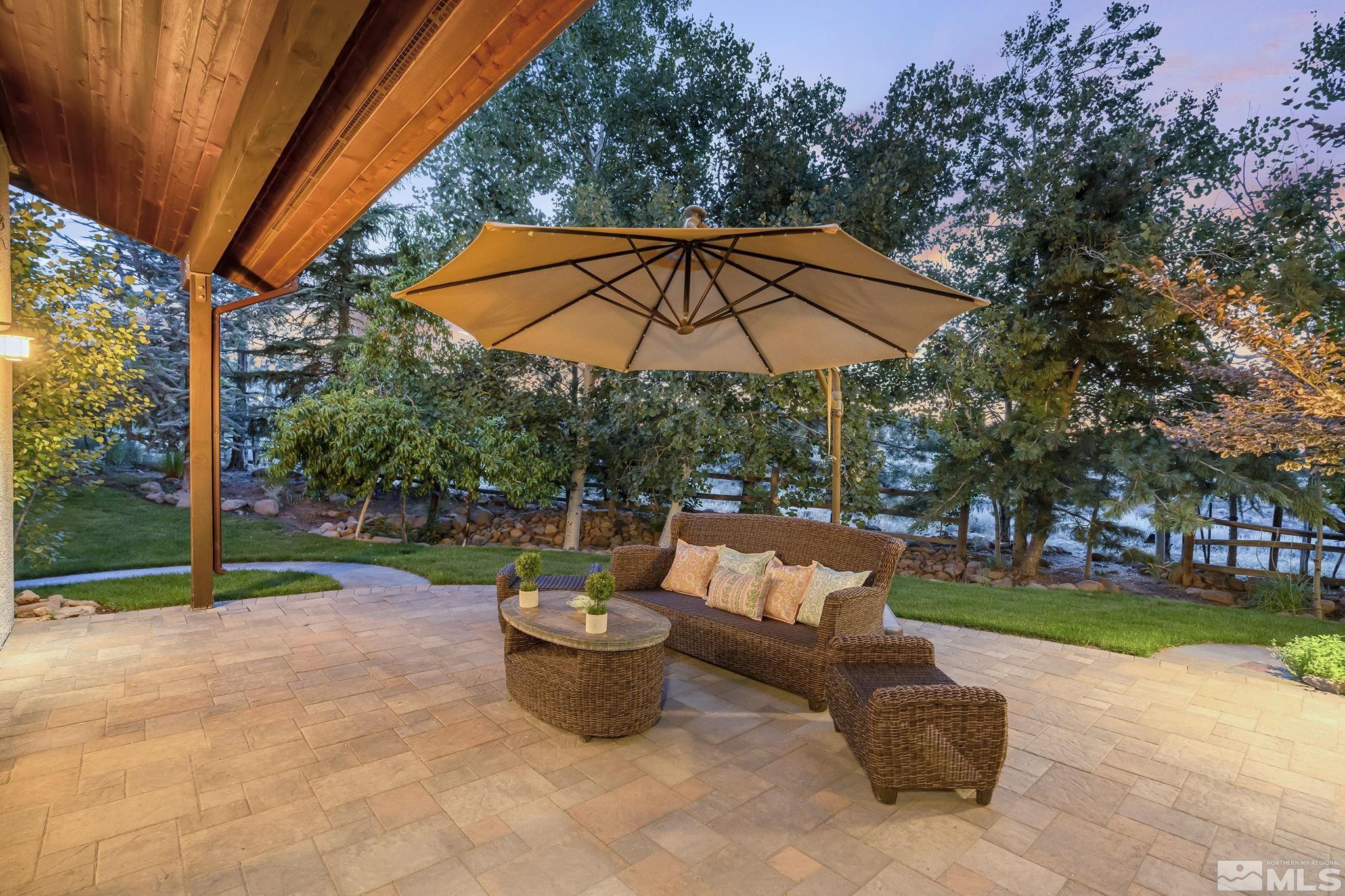 7035 Quail Rock Lane Reno, NV 89511 - Photo 30 of 37 a view of backyard with swimming pool and patio