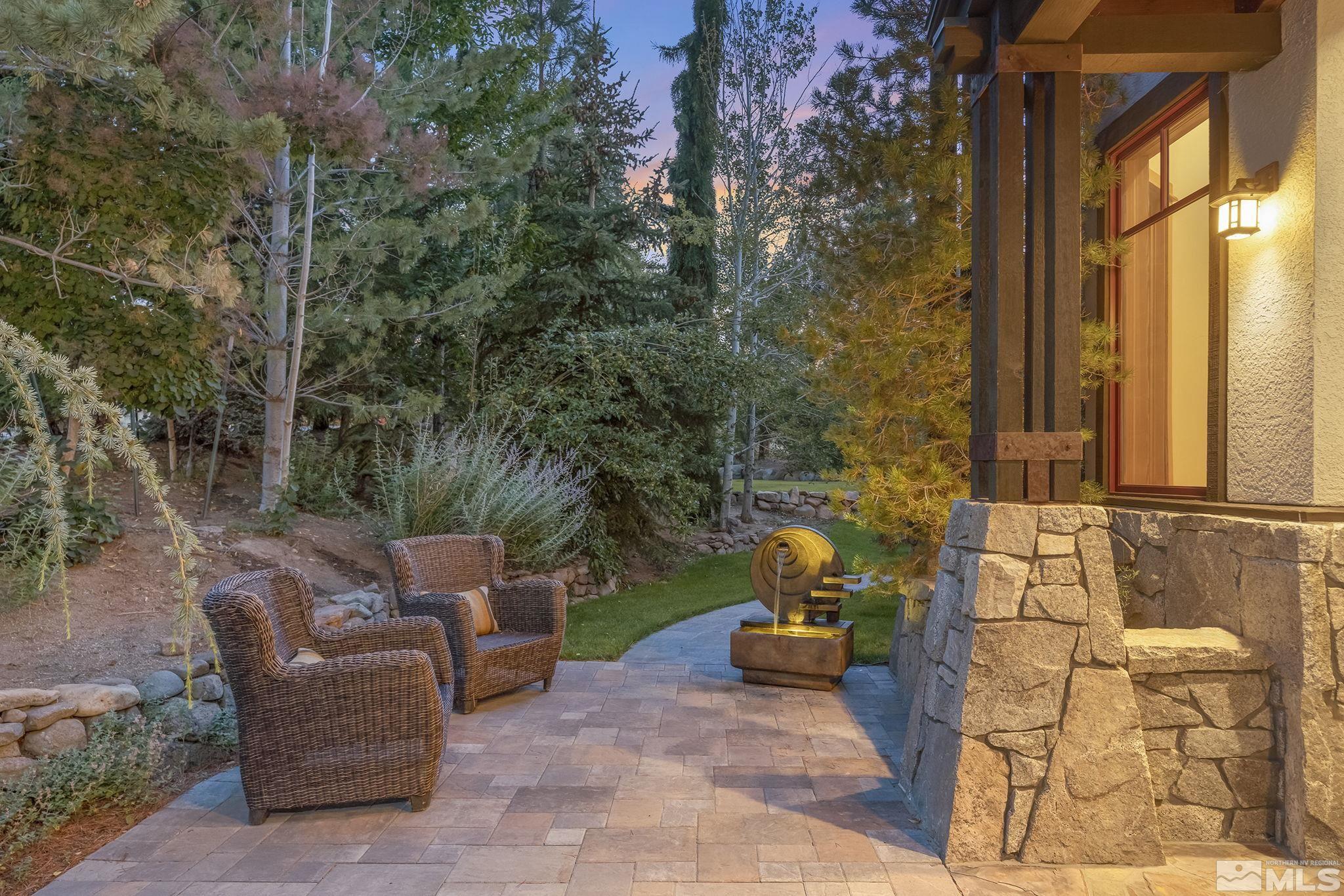 7035 Quail Rock Lane Reno, NV 89511 - Photo 31 of 37 a view of a patio with table and chairs and couches