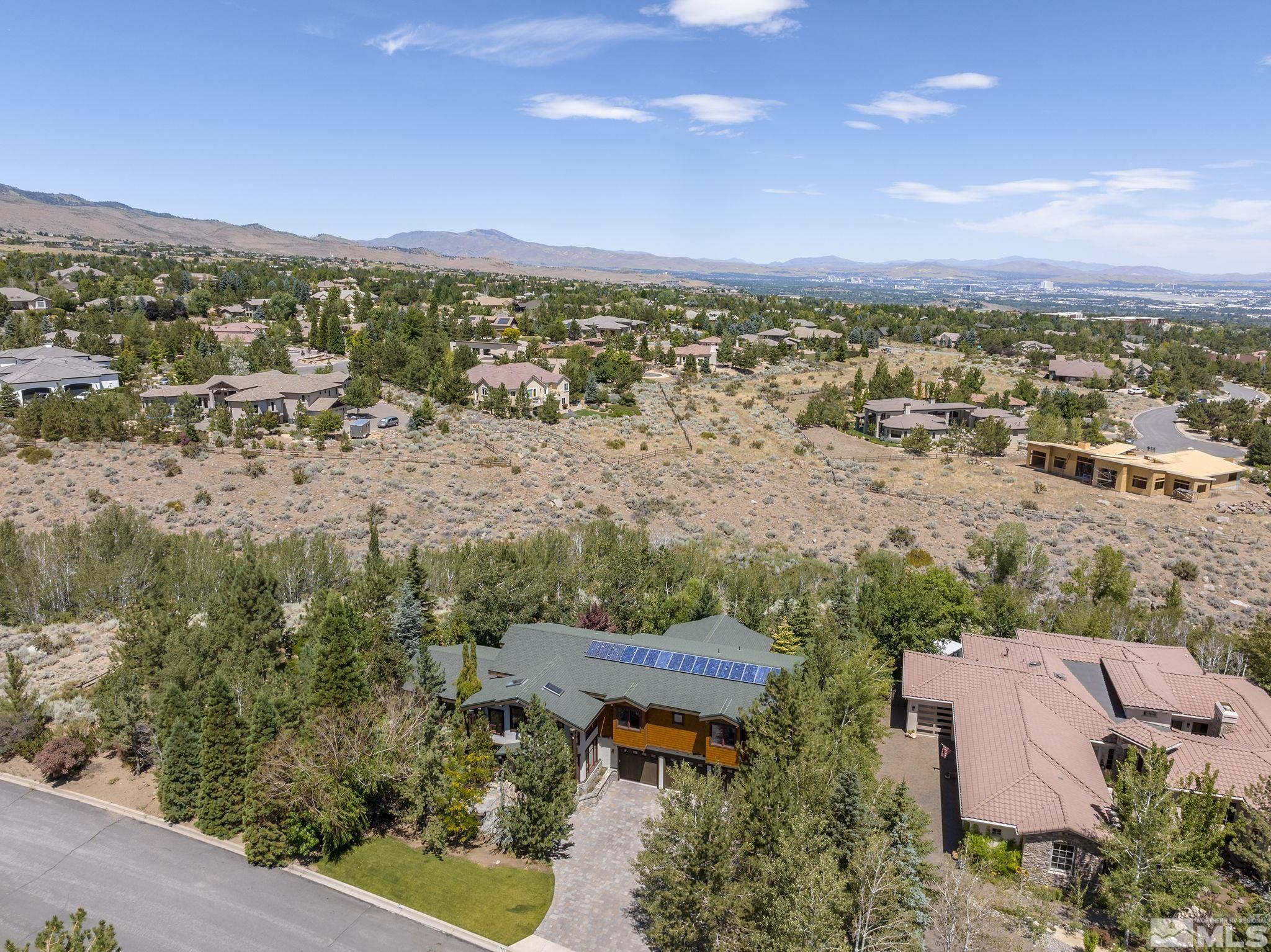 7035 Quail Rock Lane Reno, NV 89511 - Photo 36 of 37 an aerial view of a house with a lake view