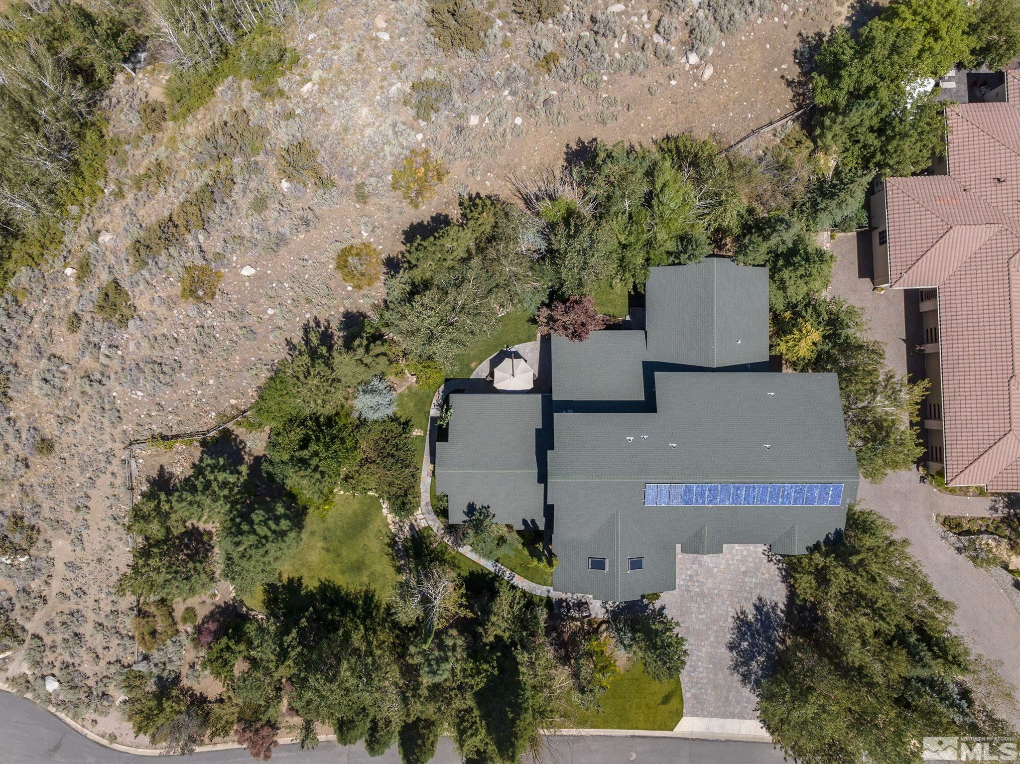 7035 Quail Rock Lane Reno, NV 89511 - Photo 37 of 37 an aerial view of residential houses with outdoor space