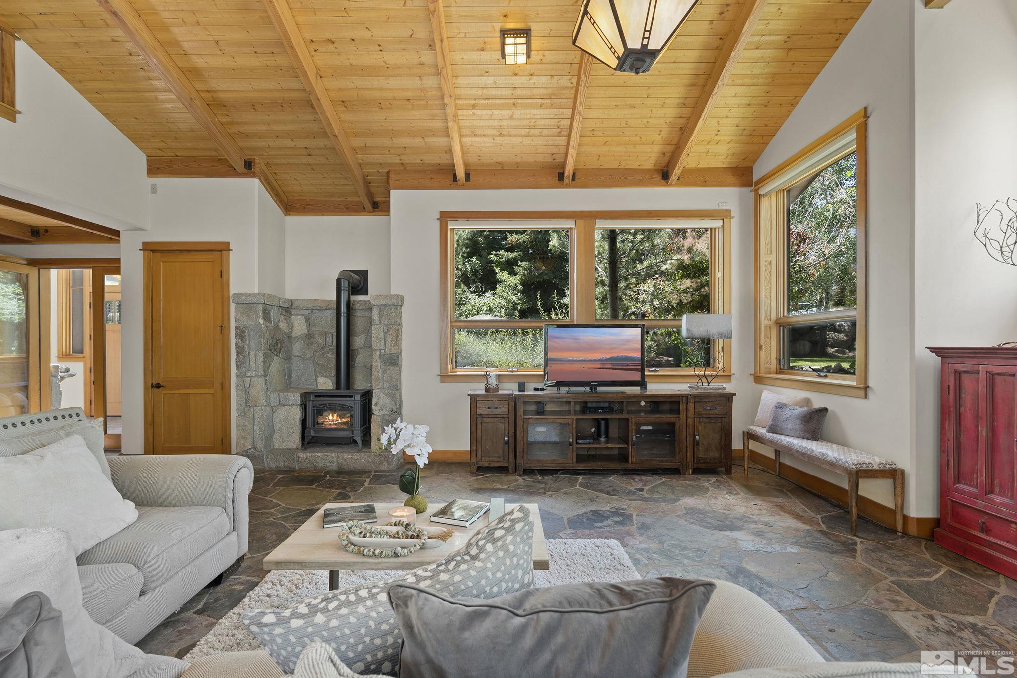 7035 Quail Rock Lane Reno, NV 89511 - Photo 8 of 37 a living room with furniture and a large window