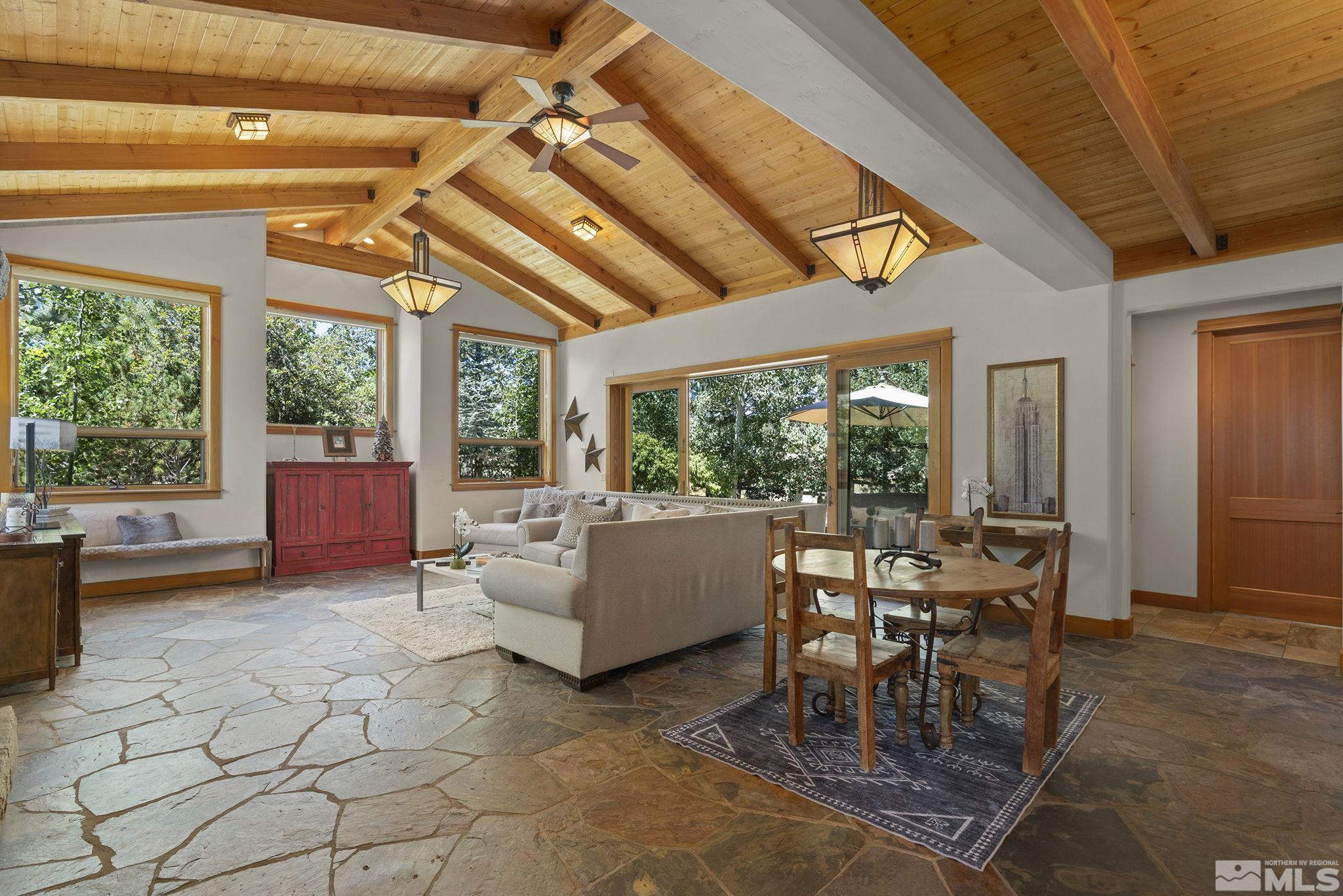 7035 Quail Rock Lane Reno, NV 89511 - Photo 10 of 37 a living room with furniture and a large window