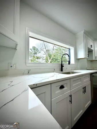 a bathroom with a glass shower door