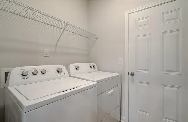 a utility room with dryer and washer