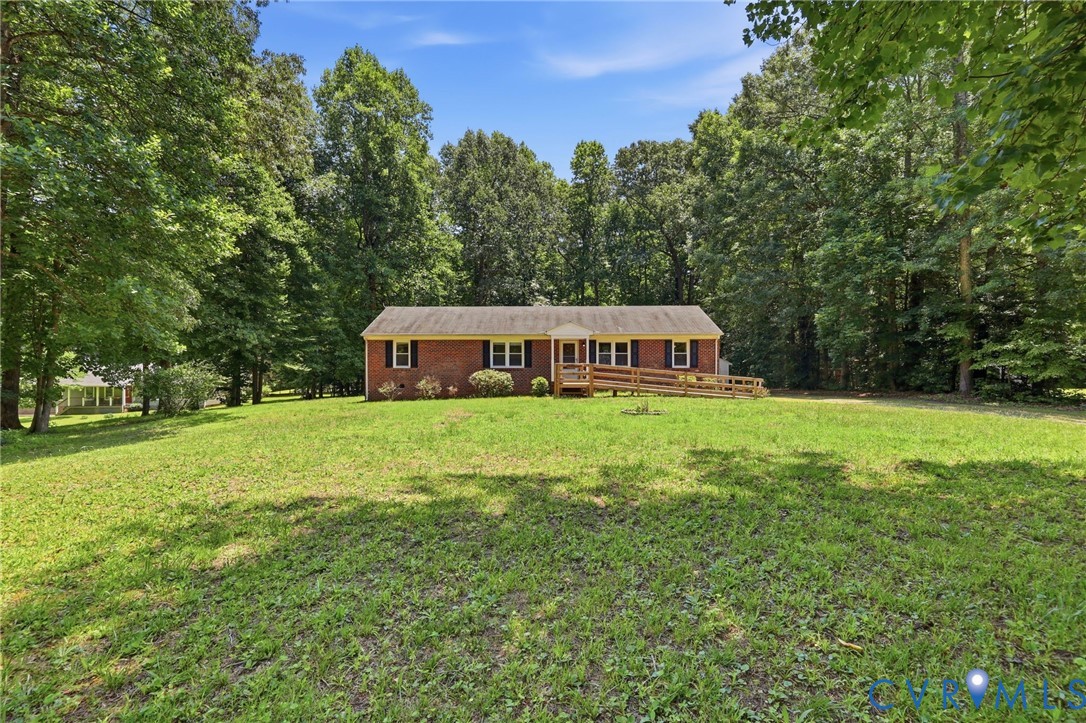 10111 Tunstall Road New Kent, VA 23124 - Photo 44 of 52 Brick exterior with a gabled roof and white trim