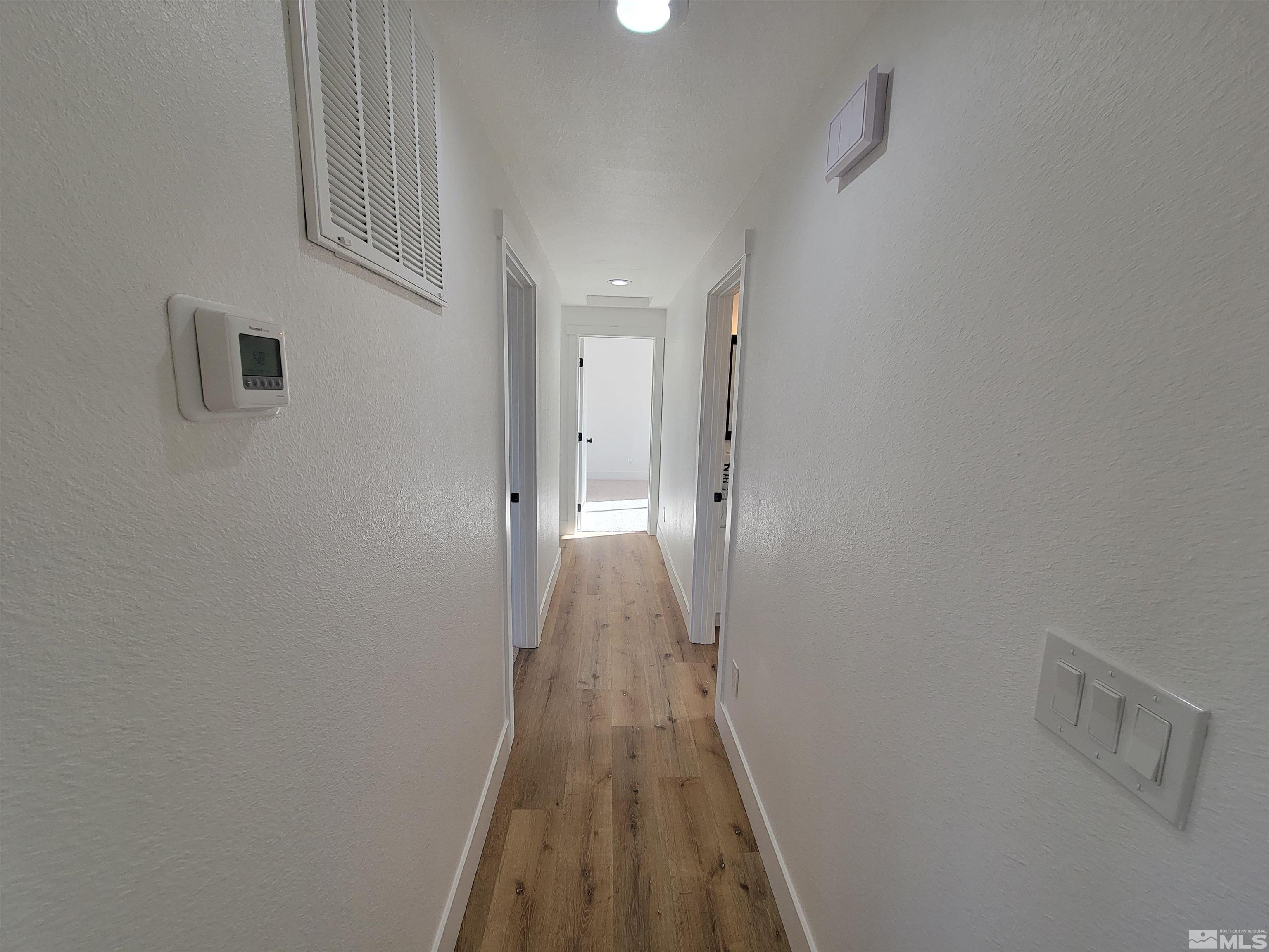 1920 West 7th Street Reno, NV 89503 - Photo 11 of 23 a view of a hallway with wooden floor and closet