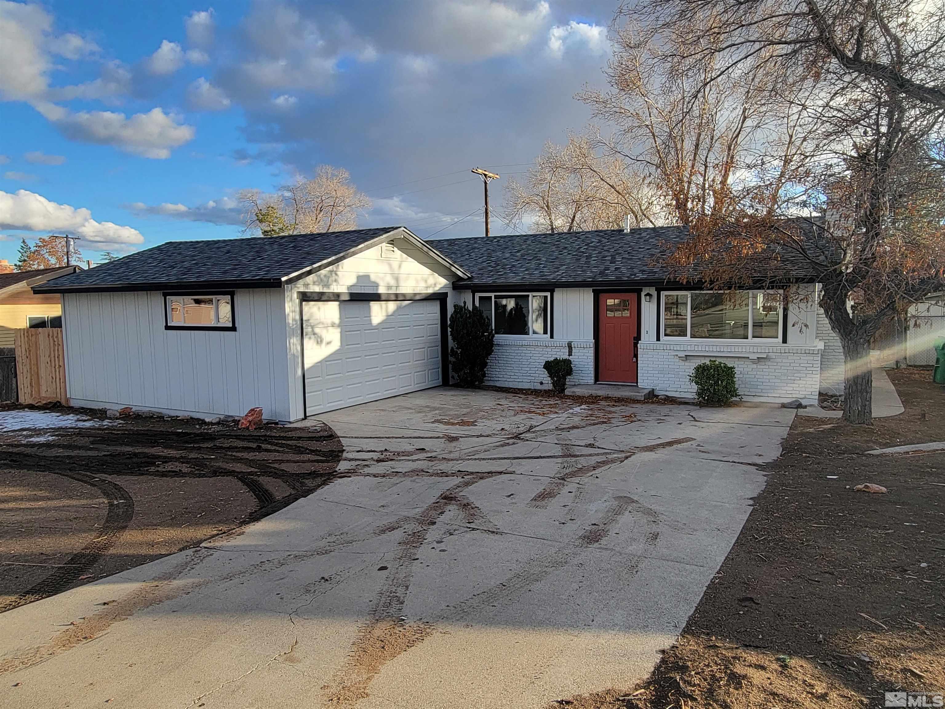 1920 West 7th Street Reno, NV 89503 - Photo 2 of 23 a front view of a house with a yard