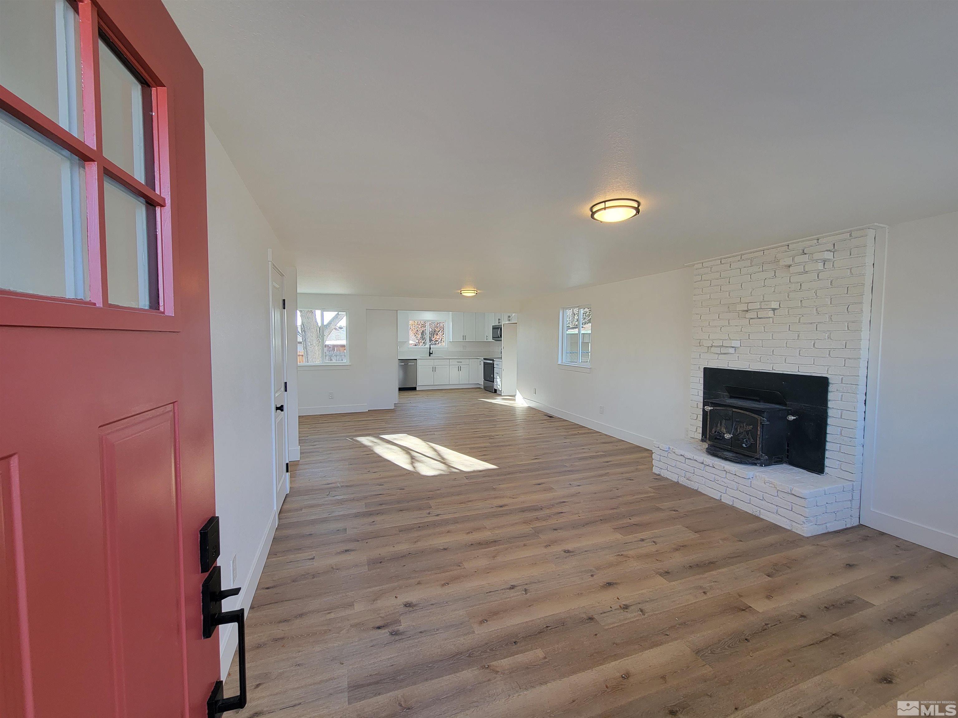 1920 West 7th Street Reno, NV 89503 - Photo 4 of 23 a view of empty room with wooden floor and fan