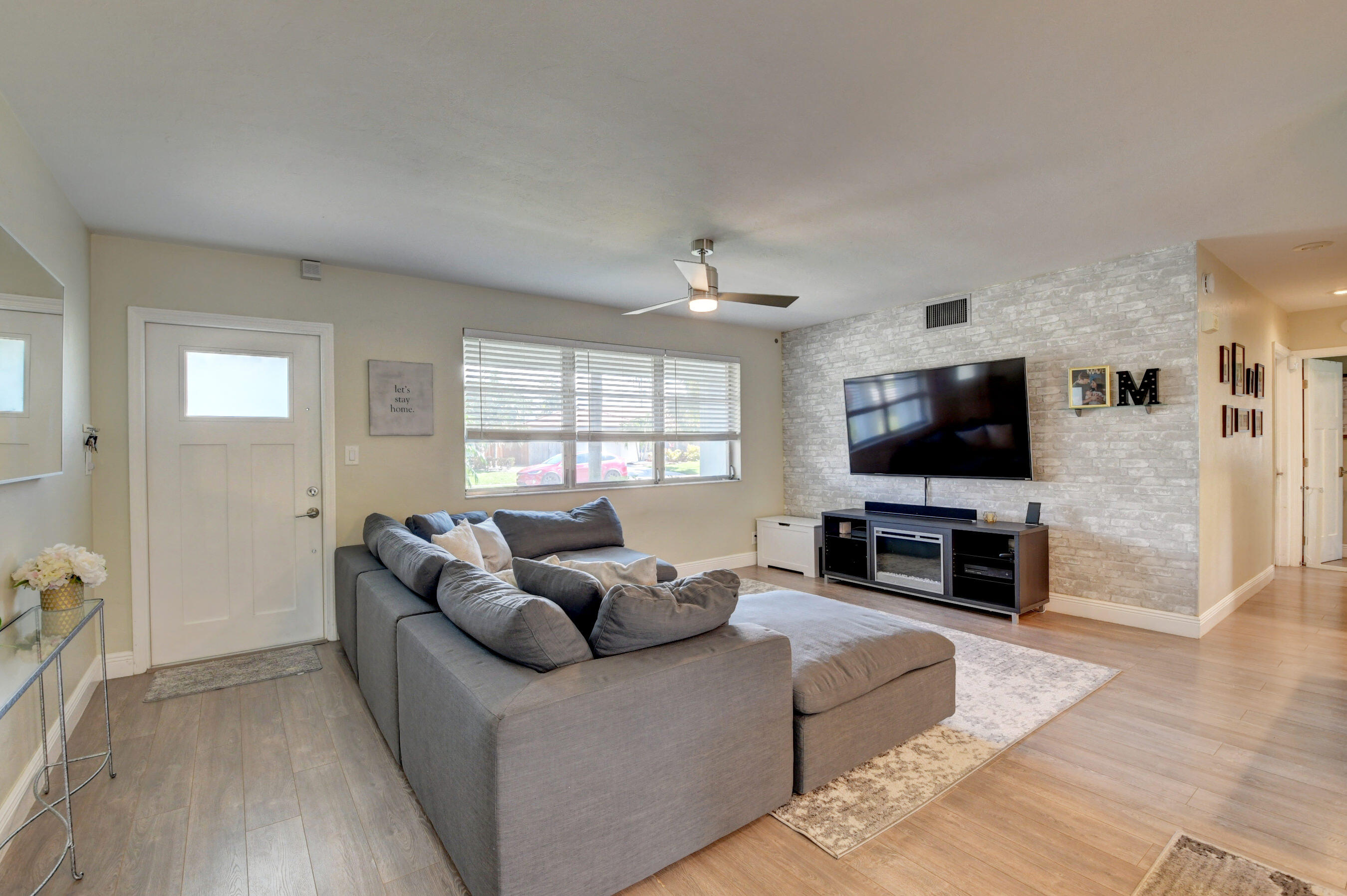 956 Southwest 4th Street Boca Raton, FL 33486 - Photo 14 of 52 a living room with furniture and a flat screen tv