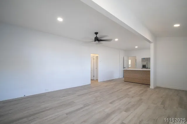 a kitchen with stainless steel appliances granite countertop a sink and a refrigerator