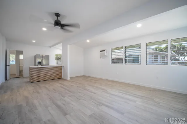 a kitchen with a sink refrigerator and microwave
