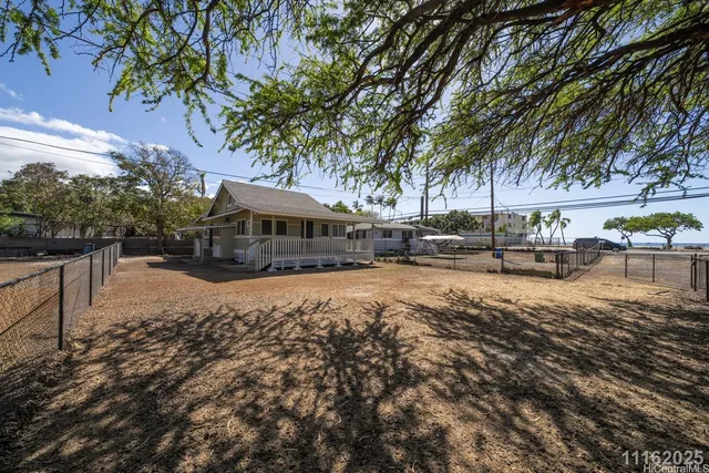 a view of house with outdoor space and sitting area