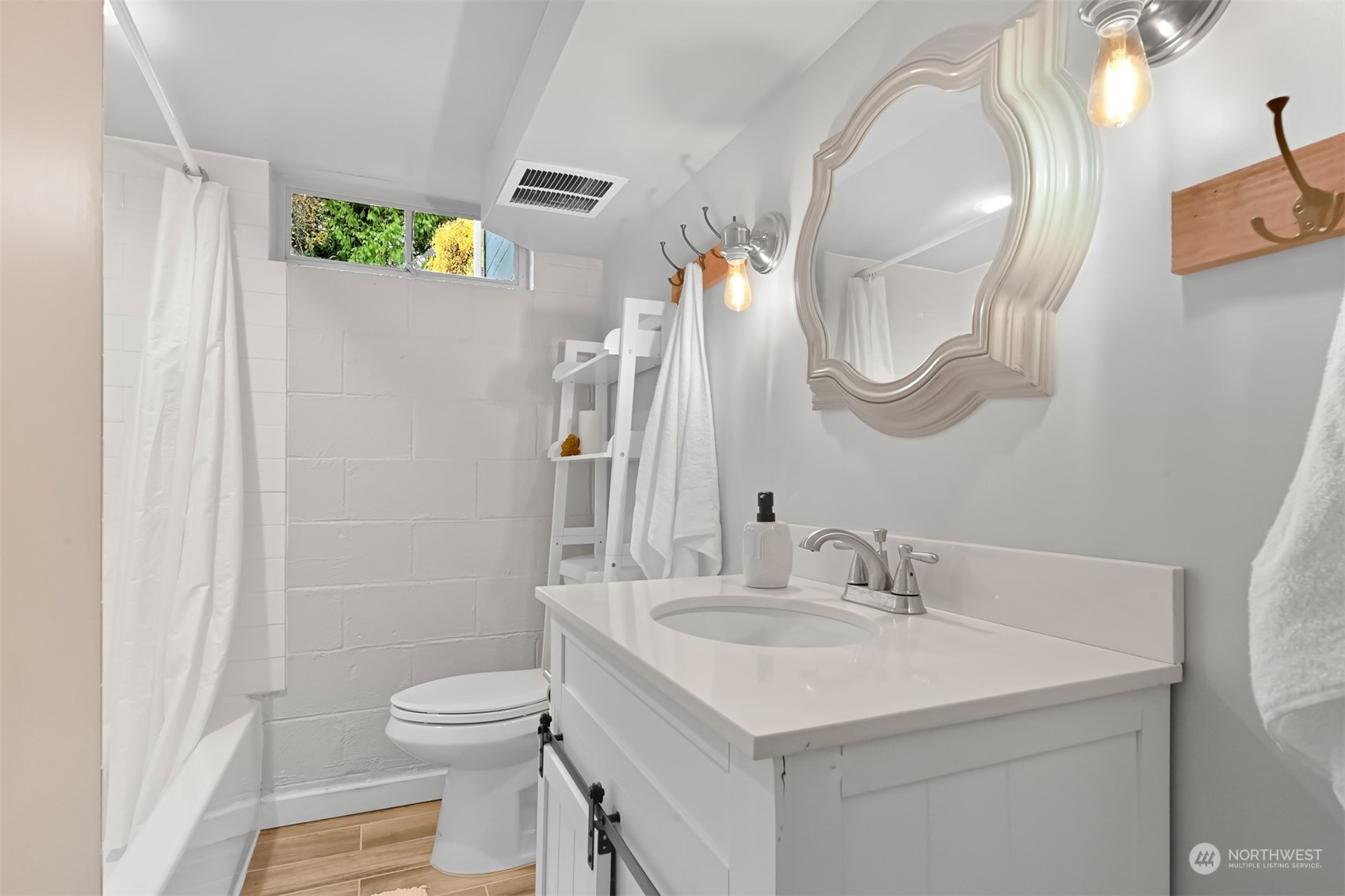 2907 Lynn Street Bellingham, WA 98225 - Photo 25 of 40 a bathroom with a toilet sink and mirror