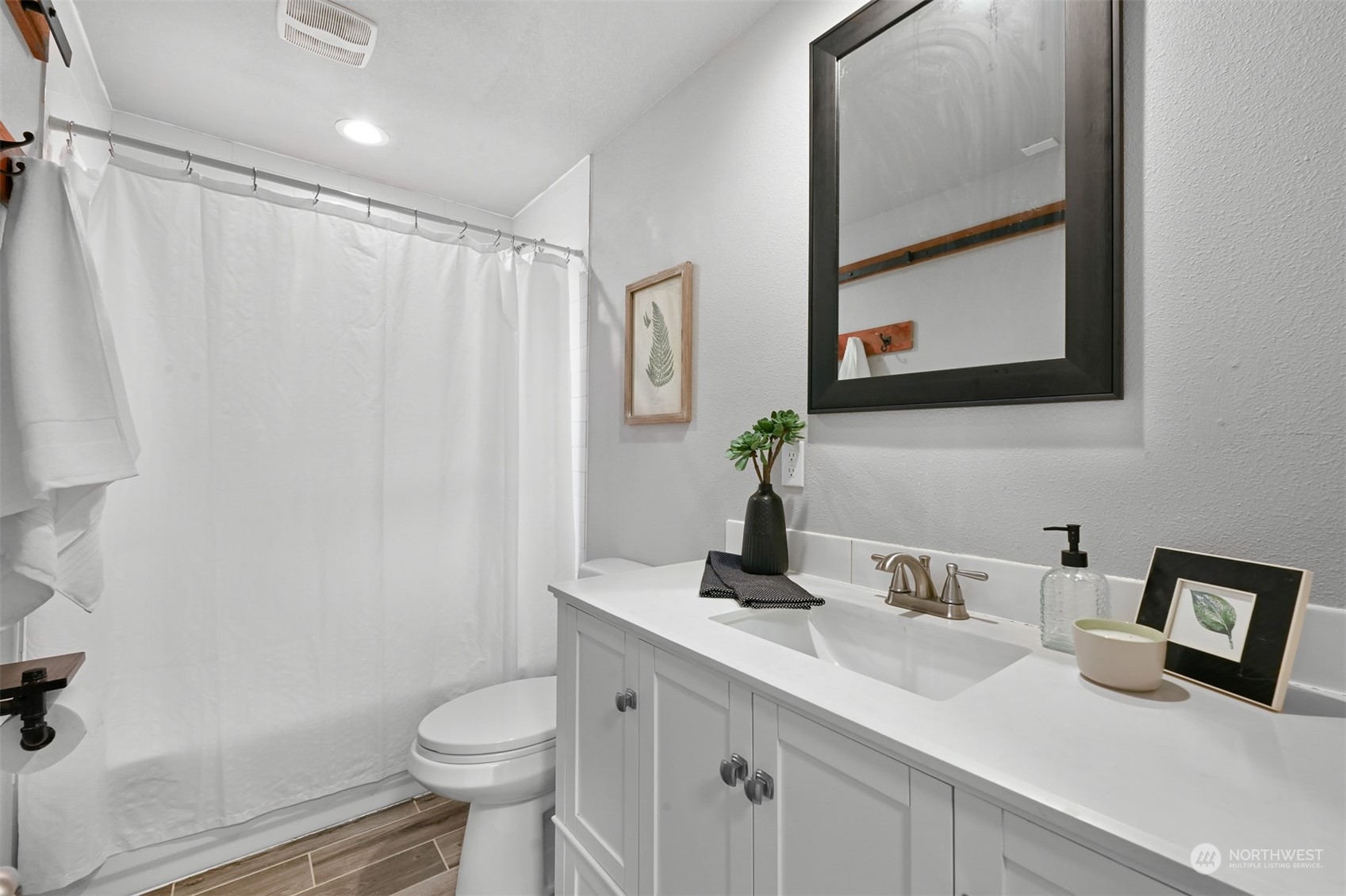 2907 Lynn Street Bellingham, WA 98225 - Photo 9 of 40 a bathroom with a granite countertop sink toilet and a mirror