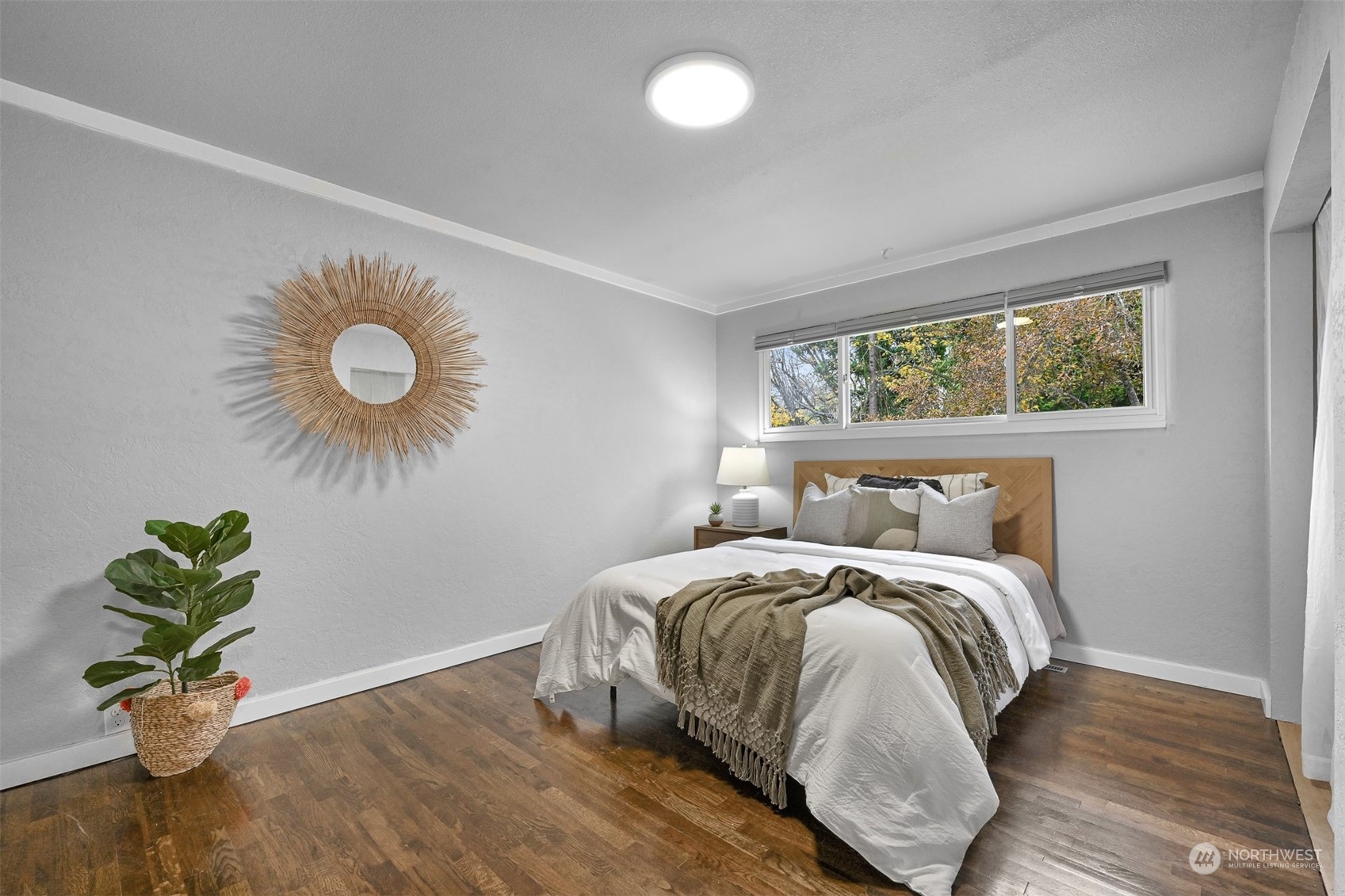 2907 Lynn Street Bellingham, WA 98225 - Photo 10 of 40 a bedroom with a bed and a potted plant