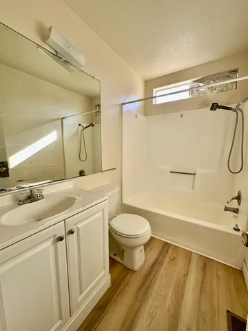 a bathroom with a sink a toilet and a bathtub