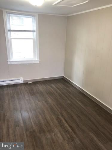 620 Frederick Street Hanover, PA 17331 - Photo 6 of 9 a view of an empty room with wooden floor and a window