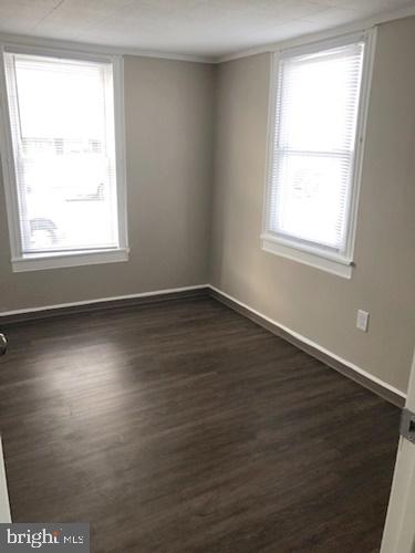620 Frederick Street Hanover, PA 17331 - Photo 8 of 9 a view of an empty room with wooden floor and a window