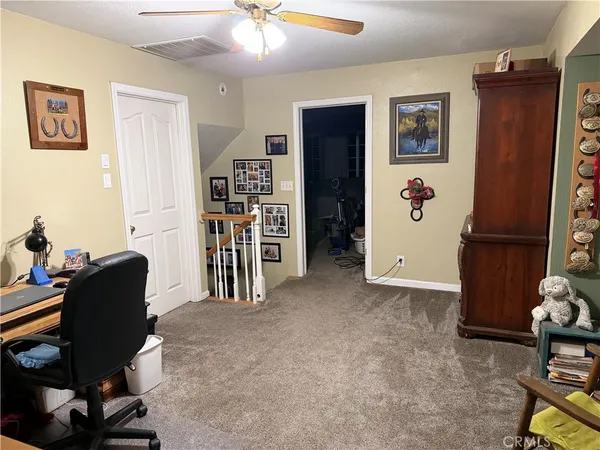 a view of walk in closet with clothes