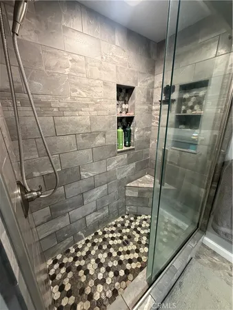 a bathroom with a toilet sink and shower