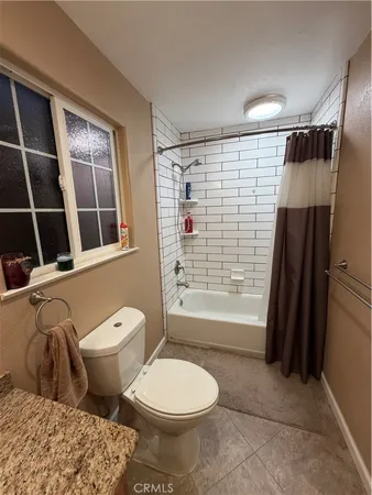 a view of a chairs and table in a balcony