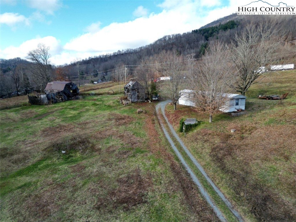337-339 Greer Lane Vilas, NC 28692 - Photo 10 of 11 a backyard of a house with lots of green space
