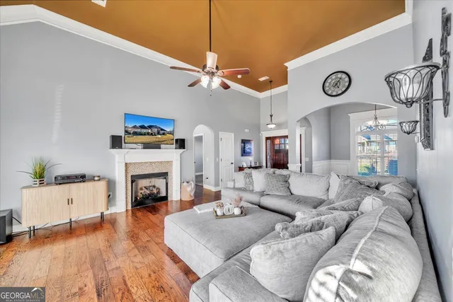 a living room with furniture and a fireplace