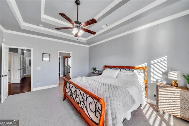 a bed room with a bed and a chandelier