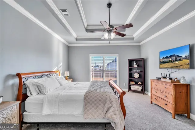 a bedroom with a bed and dresser