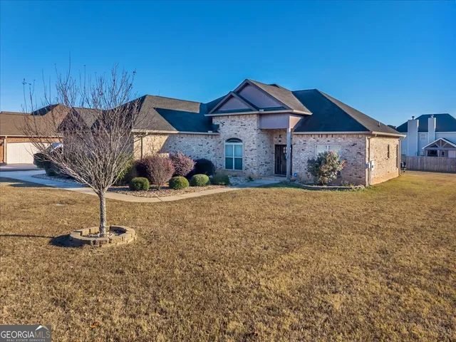 a front view of a house with a yard
