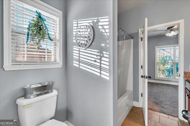 a bathroom with a toilet and a sink
