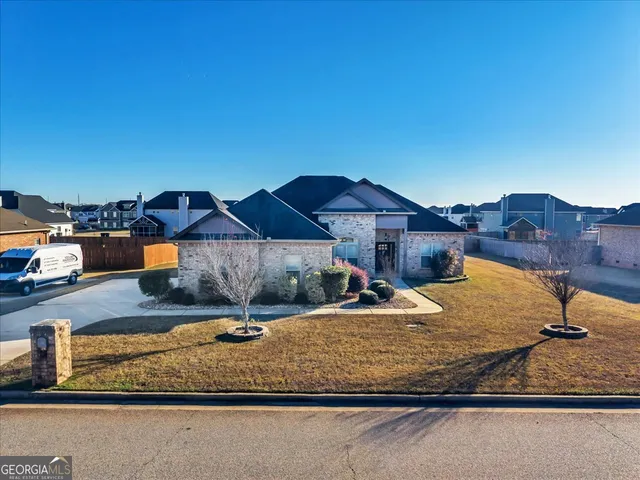 a house view with a backyard space