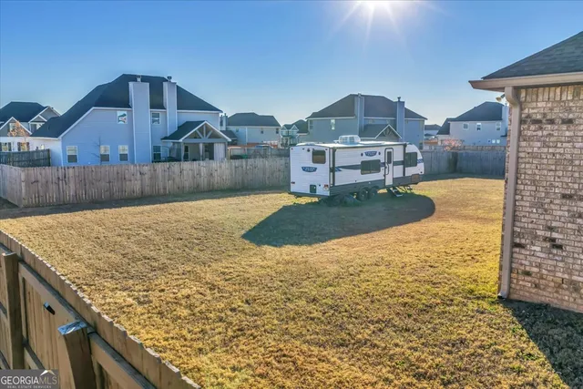 a view of residential houses with outdoor space