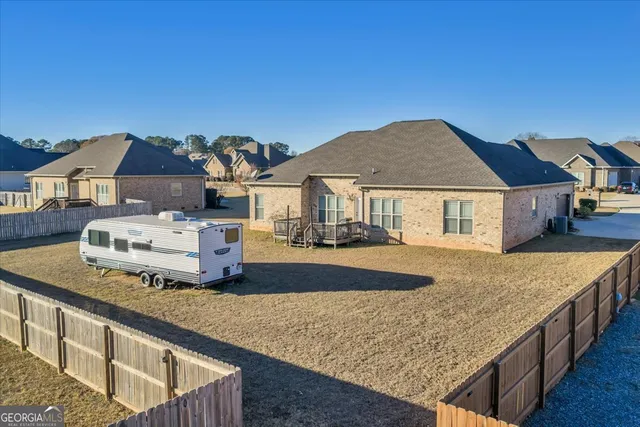 a front view of house with yard outdoor seating and barbeque oven