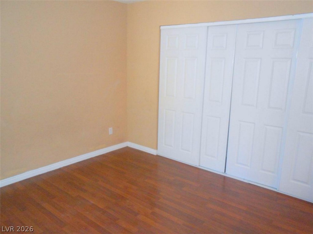 9325 West Desert Inn Road, Unit 132 Las Vegas, NV 89117 - Photo 14 of 36 Rich hardwood flooring complements a practical layout, ready for personal touches.