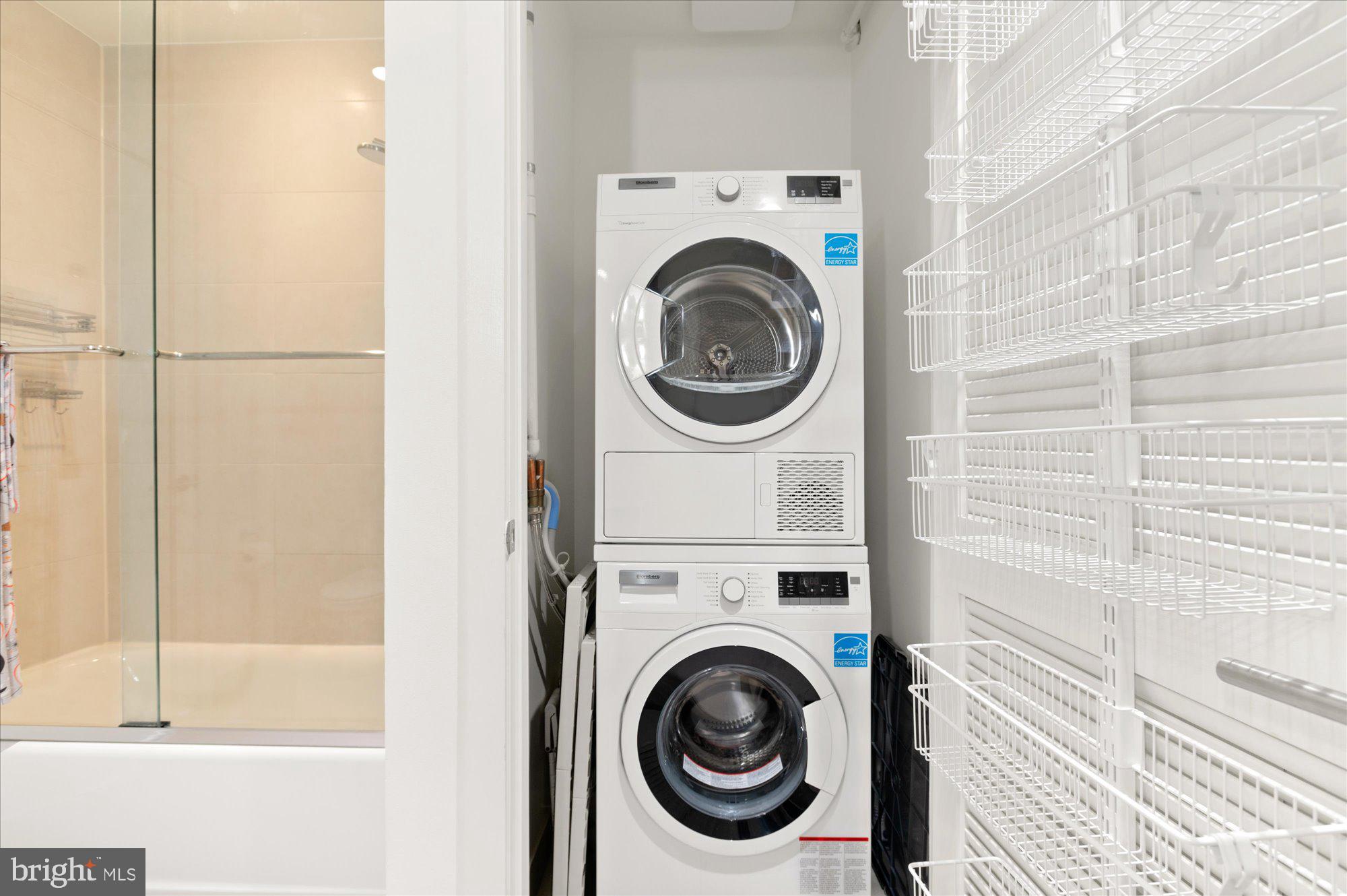 1515 15th Street Northwest, Unit 602 Washington, DC 20005 - Photo 23 of 30 a view of a hallway with washer and dryer