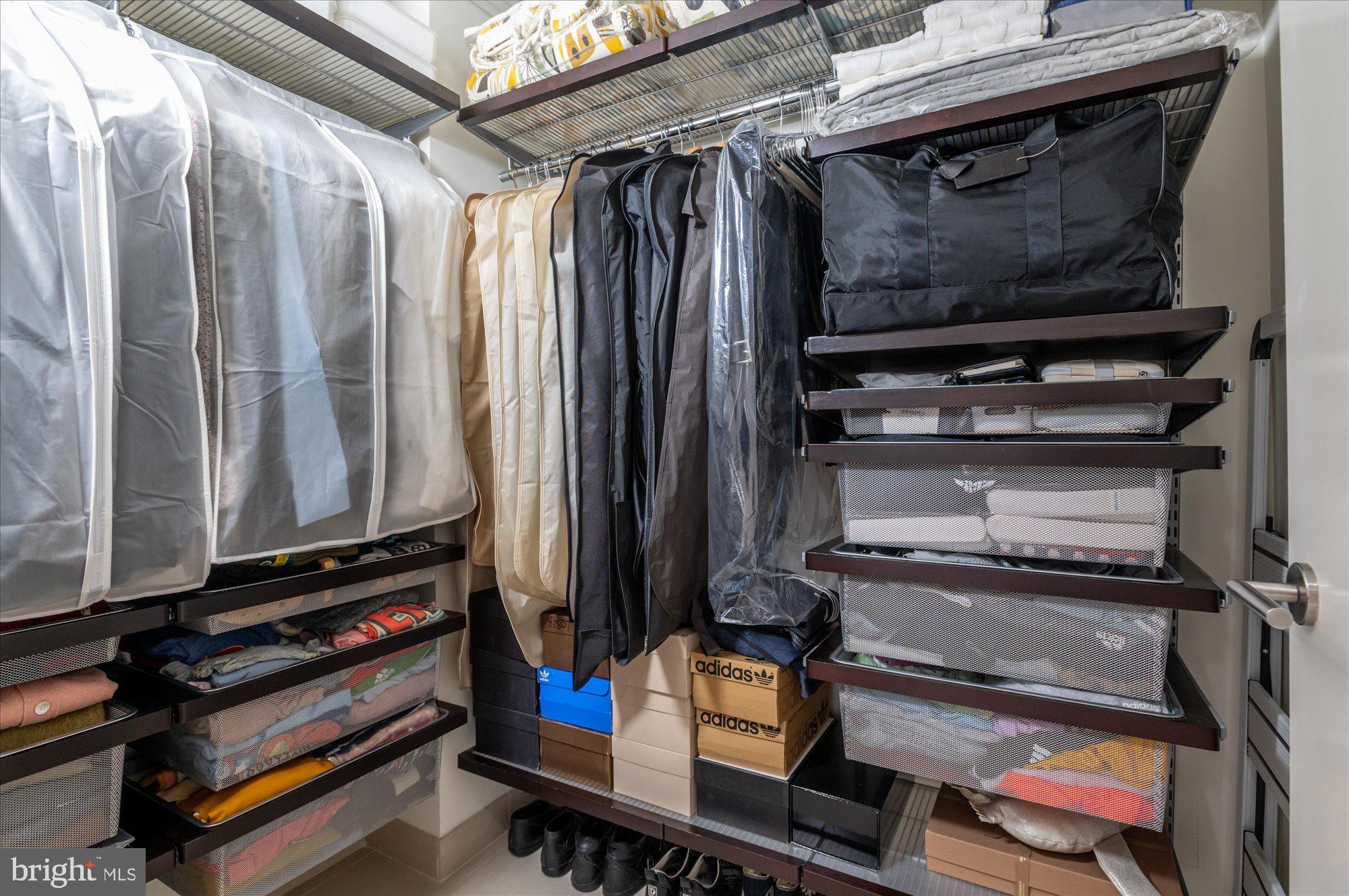 1515 15th Street Northwest, Unit 602 Washington, DC 20005 - Photo 26 of 30 a view of walk in closet with clothes and shoes