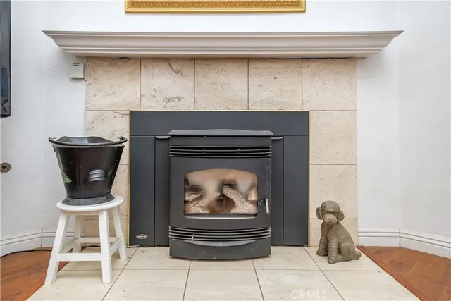 a living room with a fireplace and a table