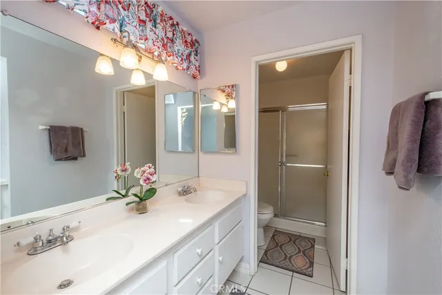 a bathroom with a shower and a toilet