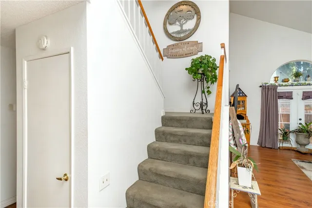 a living room with furniture rug and wooden floor