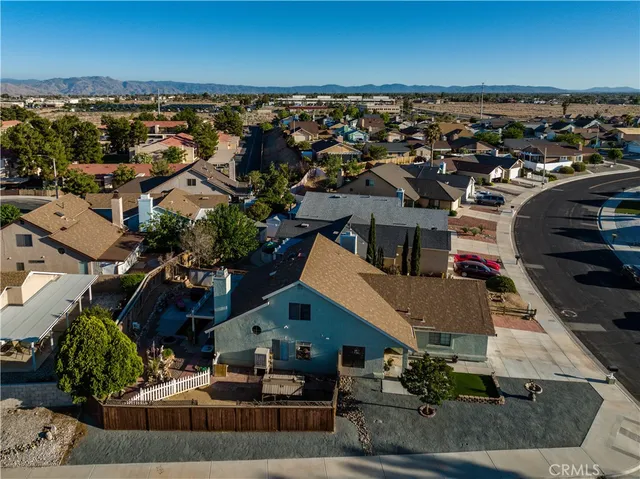 an aerial view of a house with a swimming pool