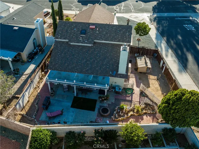 an aerial view of a house with a yard